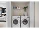 Laundry room featuring side-by-side washer and dryer units, adding convenience to the home at 6001 S Yosemite St # F207, Greenwood Village, CO 80111
