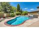 Inviting community pool with brick trim, sun loungers, and well-maintained landscaping at 6001 S Yosemite St # F207, Greenwood Village, CO 80111