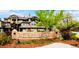 Beautiful Hermitage neighborhood sign with manicured landscaping in a serene setting at 6001 S Yosemite St # F207, Greenwood Village, CO 80111