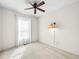 Bright bedroom with a ceiling fan, a window letting in natural light, and carpeted floors at 7323 Lowell Blvd, Westminster, CO 80030