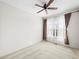 Simple bedroom featuring neutral walls, a window, and carpeted floors at 7323 Lowell Blvd, Westminster, CO 80030