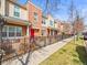 Well-maintained row of townhomes with front patios and landscaped yards along sidewalk at 7323 Lowell Blvd, Westminster, CO 80030