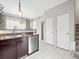 Well-lit kitchen featuring stainless steel appliances, tile floors, and ample counter space for food preparation at 7323 Lowell Blvd, Westminster, CO 80030
