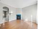 Bright living room with hardwood floors and a stylish blue fireplace mantel at 7323 Lowell Blvd, Westminster, CO 80030