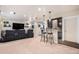 Basement theater featuring leather recliners and built in bar at 13326 Olive Way, Thornton, CO 80602