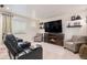 Basement theater featuring reclining chairs, built-in fireplace, and decor at 13326 Olive Way, Thornton, CO 80602