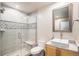 Bathroom featuring a glass enclosed shower, gray-scale tile, stone countertop, and modern fixtures at 13326 Olive Way, Thornton, CO 80602