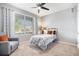 Bright bedroom with natural light, plush carpet, ceiling fan, and modern finishes for a comfortable living space at 13326 Olive Way, Thornton, CO 80602