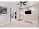 Bedroom featuring a ceiling fan, large closet, and attached bar area at 13326 Olive Way, Thornton, CO 80602
