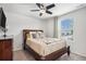 Comfortable bedroom with neutral-colored walls, carpeted floors, and a window providing natural light at 13326 Olive Way, Thornton, CO 80602