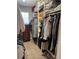 Walk-in closet provides ample storage with custom shelving and hanging space at 13326 Olive Way, Thornton, CO 80602