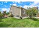 Charming home exterior with well maintained yard and mature shade tree at 13326 Olive Way, Thornton, CO 80602
