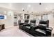 Comfortable home theater featuring plush seating, ambient lighting and convenient snack bar area at 13326 Olive Way, Thornton, CO 80602