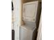 Efficient white stacked washer and dryer maximize space in laundry area at 13326 Olive Way, Thornton, CO 80602
