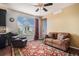 Cozy living room with a comfortable sofa, a large window providing natural light, and stylish decor at 13326 Olive Way, Thornton, CO 80602