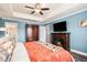 Spacious main bedroom with a fireplace, TV, and a view into the bathroom, offering a relaxing retreat at 13326 Olive Way, Thornton, CO 80602