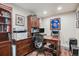Home office featuring a large desk, ample storage, and plenty of light for a productive workspace at 13326 Olive Way, Thornton, CO 80602