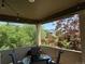 Outdoor patio with table, chairs, and string lights with a view of mature trees at 13326 Olive Way, Thornton, CO 80602