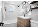 Modern bathroom with sleek vanity, stylish fixtures, and a tub at 5231 Quitman St, Denver, CO 80212