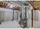 Basement with a water heater and furnace at 11867 Elk Head Range Rd, Littleton, CO 80127