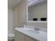 Bright bathroom features a shower and a vanity with a large mirror at 11867 Elk Head Range Rd, Littleton, CO 80127