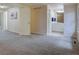 Expansive, carpeted bedroom leading to a bathroom suite for added convenience at 11867 Elk Head Range Rd, Littleton, CO 80127