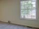 Bright bedroom with a large window offering ample natural light and scenic views at 11867 Elk Head Range Rd, Littleton, CO 80127