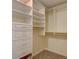 Well-organized walk-in closet with built-in shelving and ample storage space at 11867 Elk Head Range Rd, Littleton, CO 80127