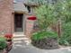 Charming home with brick facade, landscaped yard and inviting front entrance at 11867 Elk Head Range Rd, Littleton, CO 80127