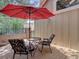 Relaxing outdoor patio with seating and a red umbrella at 11867 Elk Head Range Rd, Littleton, CO 80127