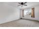 Well-lit bedroom featuring ceiling fan and carpet at 13626 E Bates Ave # 207, Aurora, CO 80014
