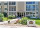 Building 203 entrance with landscaping and a sign to welcome visitors at 13626 E Bates Ave # 207, Aurora, CO 80014