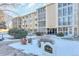 Building exterior showcasing landscaping and snow at 13626 E Bates Ave # 207, Aurora, CO 80014