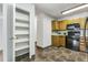 Kitchen area with ample storage and black appliances at 13626 E Bates Ave # 207, Aurora, CO 80014