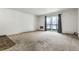 Living room with carpet and access to a balcony at 13626 E Bates Ave # 207, Aurora, CO 80014