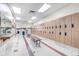 Convenient locker room with ample storage, bench seating and adjacent restroom and sink at 13626 E Bates Ave # 207, Aurora, CO 80014