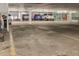 Parking garage with several cars and a yellow line marking parking spaces at 13626 E Bates Ave # 207, Aurora, CO 80014