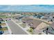 Neighborhood aerial view featuring a manicured street and mountain views at 1005 Alpine Aven St, Henderson, CO 80640
