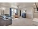 Bonus room with a ceiling fan, bar area, and neutral color scheme at 1005 Alpine Aven St, Henderson, CO 80640