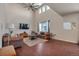 Inviting living room featuring high ceilings, ceiling fan, and plenty of natural light at 1005 Alpine Aven St, Henderson, CO 80640
