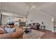 Open floor plan living room leading to the kitchen, with modern decor at 1005 Alpine Aven St, Henderson, CO 80640