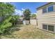 View of the home's back yard with partial fencing and a small storage shed at 8848 Prickly Pear Cir, Parker, CO 80134