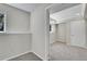 A view of the basement with painted white walls and trim, and grey carpet flooring with some natural light at 8848 Prickly Pear Cir, Parker, CO 80134