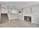 Inviting basement with a fireplace and stairs leading up to main level, creating a seamless flow throughout the home at 8848 Prickly Pear Cir, Parker, CO 80134