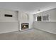 Cozy basement features a decorative fireplace and a well-lit window, creating a warm and inviting atmosphere at 8848 Prickly Pear Cir, Parker, CO 80134