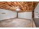 Spacious two car garage with exposed rafters and a bright, freshly painted interior at 8848 Prickly Pear Cir, Parker, CO 80134