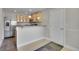 Charming kitchen featuring stainless steel appliances and stylish light wood cabinets, complete with a breakfast bar area at 8848 Prickly Pear Cir, Parker, CO 80134