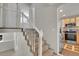 Carpeted staircase leading to an upper level alongside the kitchen featuring stainless steel appliances at 8848 Prickly Pear Cir, Parker, CO 80134