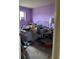 A bedroom with purple walls, a metal bed frame, and a window at 3150 W 134Th Ave, Broomfield, CO 80020