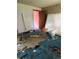 Interior photo of a bedroom exhibiting damaged flooring and old mattress at 3150 W 134Th Ave, Broomfield, CO 80020